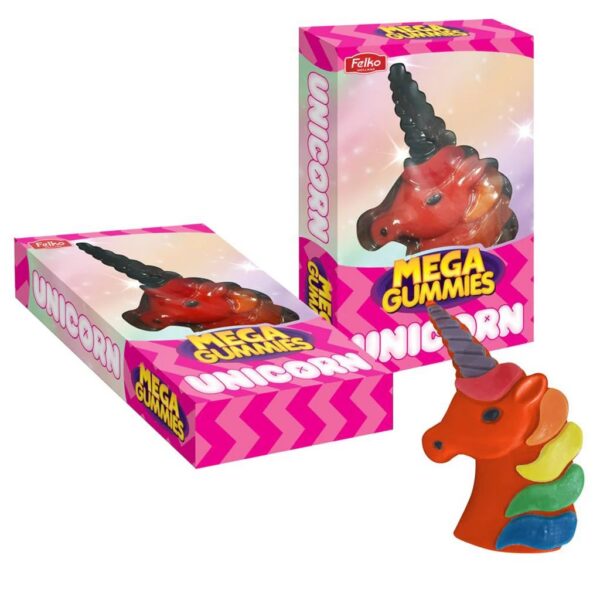 Bonbon géant en forme de tête de licorne colorée à côté de sa boîte d'emballage rose "Mega Gummies Unicorn" de la marque Felko.